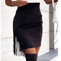 Black fringe skirt worn by a person with a blurred background